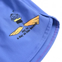 A Day At The Beach Swim Trunks by Bobo Choses