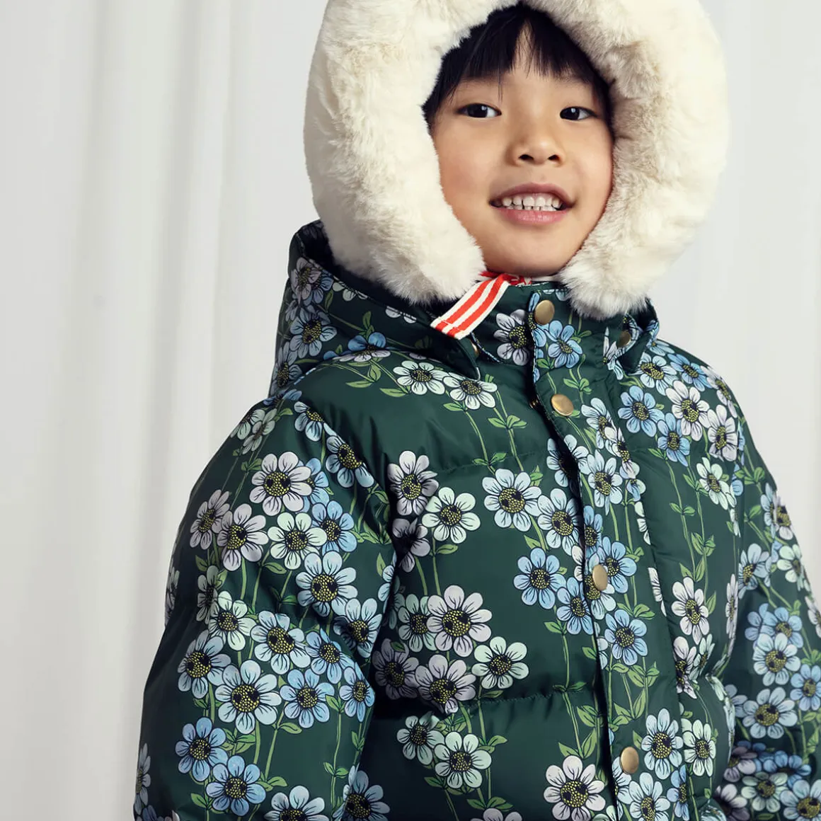 Daisies AOP Hooded Puffer Jacket in Green by Mini Rodini