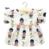 Daisy Dress (34cm Doll) in Jade Print by Minikane