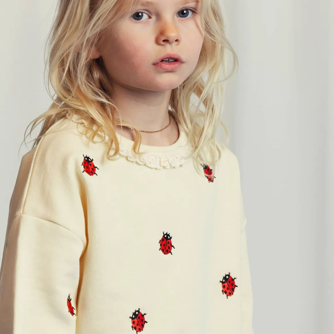 Ladybugs Embroidered Lace Sweatshirt in Off White by Mini Rodini