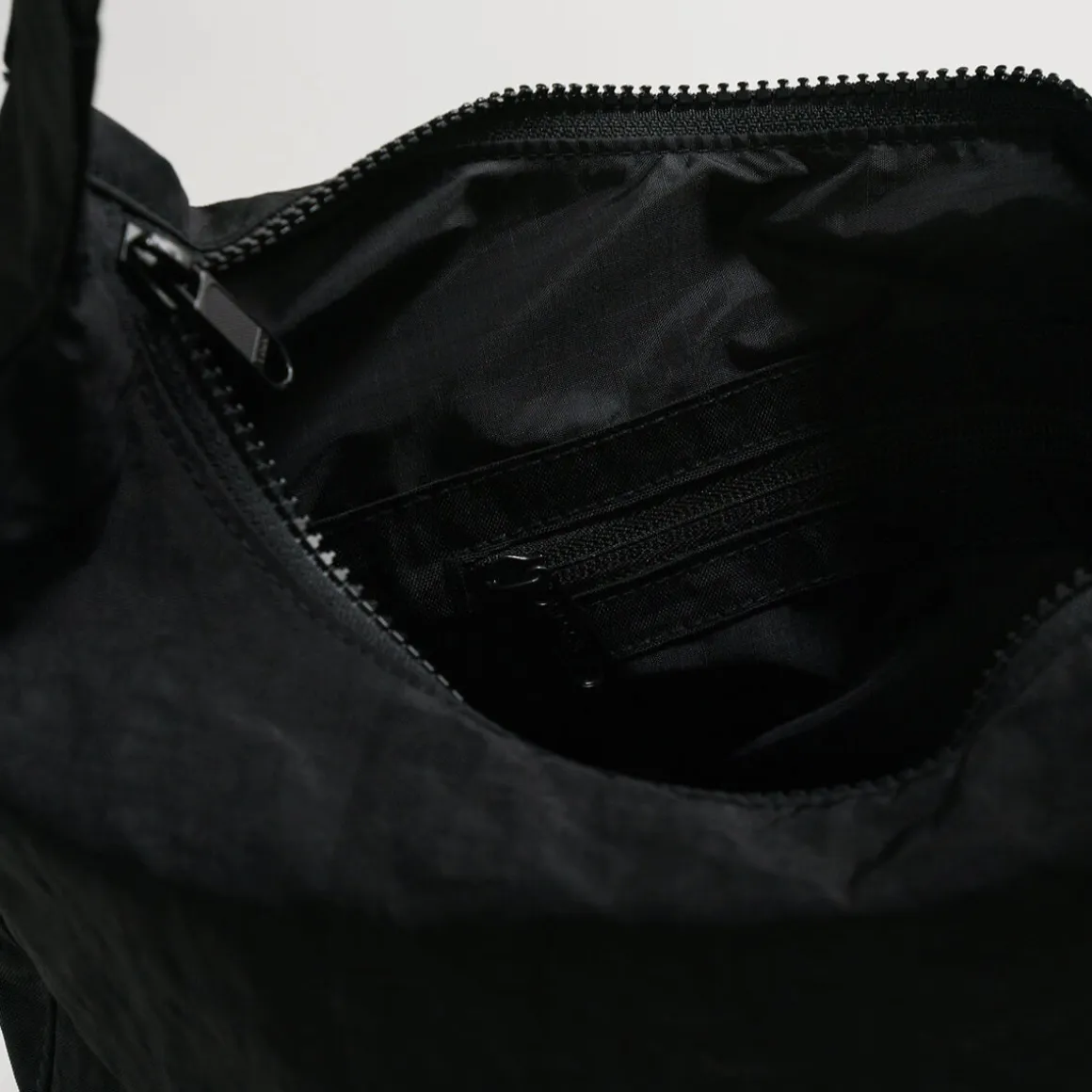 Medium Nylon Crescent Bag in Black by Baggu