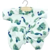 Noa Romper and Bonnet Set (28cm Doll) in Baby Peacock Print by Minikane
