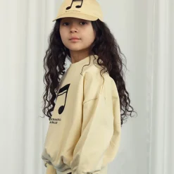 Note Embroidered Cap by Mini Rodini