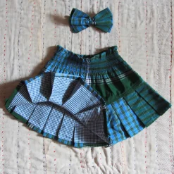 Pleated Skirt With Hair Clip in Green Lungi Check by Bonjour