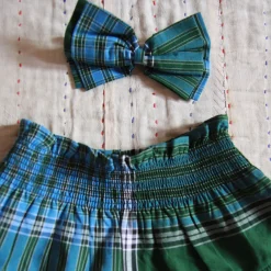 Pleated Skirt With Hair Clip in Green Lungi Check by Bonjour