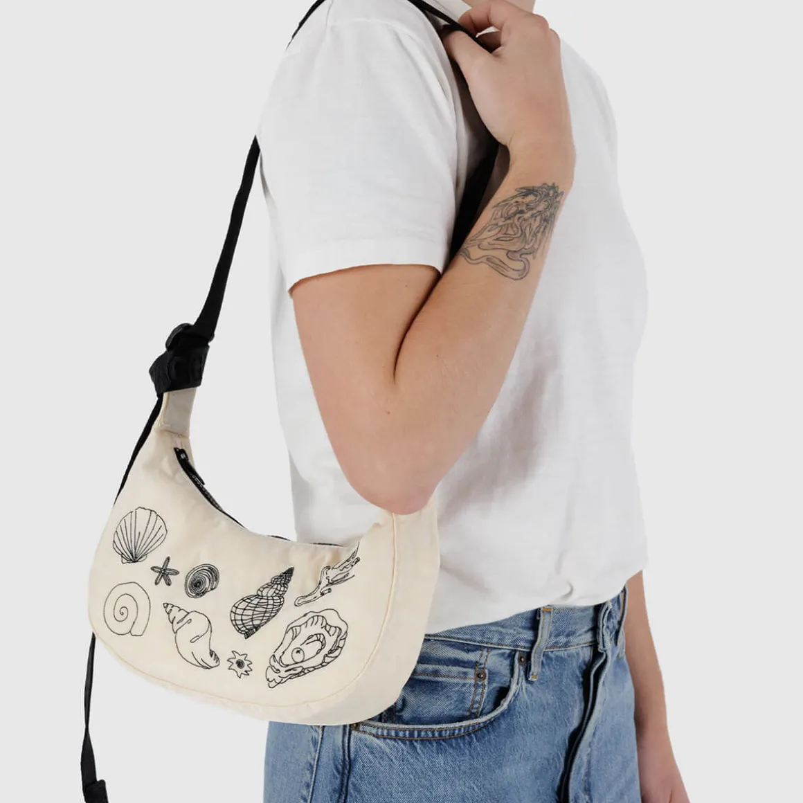 Small Nylon Crescent Bag in Embroidered Shells by Baggu